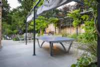Canopied games area with a table tennis table.