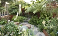 Out of the Shadows contemporary spa garden with hardy tropical planting, jacuzzi and outdoor shower