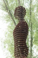 Figure of corten steel made by nature artist Will Beckers.