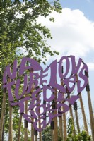 Purple graphic sign made of wood: 
