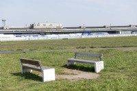 Berlin Germany 
Now redundant Berlin Tempelhof Airport. Now a recreational space known as Tempelhofer Feld . 
Benches in front of the former apron and terminal buildings. 