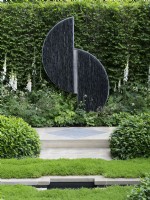 RHS How Garden - A garden designed With Love detail of sculpture amid white and green planting