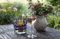 Lavender candle holder, glass of wine and bouquets of summer flowers on a garden table - Step by step How to make a lavender candle holder
