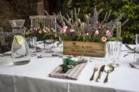 Set garden table with lavender, flowers and candles - Lavender summer party story