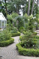 Box Garden leading to West Pergola at Hamilton House garden in May 