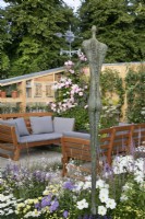 Seating area in #knollingwithdaisies garden at RHS Hampton Court Palace Garden Festival 2022