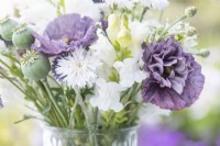 Bouquet containing Poppy seed pods, Papaver rhoeas 'Amazing Grey' - Poppy, Centaurea 'Ball White', Centranthus ruber White - Valerian, Antirrhinum 'White Admiral' and Echinops ritro 'Globe Thistle'