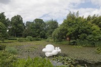 General View Arboretum Kalmthout, Provincie Antwerpen, Belgium. View over pond with sculpture.