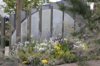 Metal screens dividing the garden in The Joy Club Garden at RHS Hampton Court Palace Garden Festival 2022