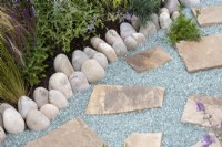 Recycled glass stone pathway on the Journey Home garden RHS Tatton Park Flower Show 2022 - Designed by Rachael Bennion and Petrus Community
