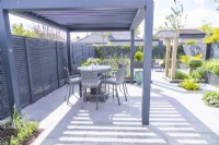 Pergola with roof slats opened to allow sunlight through