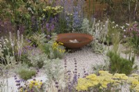 Drought-tolerant herbaceous planting with water bowl feature - Turfed Out Garden, RHS Hampton Court Palace Garden Festival 2022.  July.  Designer: Hamzah-Adam Desai  