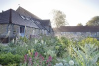 Hailstone Barn, Gloucestershire, gravel garden with late May perennial planting.