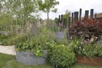Circular reclaimed industrial planters in The Vitamin G Garden at RHS Hampton Court Palace Garden Festival 2022