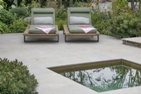 Patio area with plunge pool in The Sunslifestyle Outdoor Living garden at RHS Hampton Court Palace Garden Festival 2022