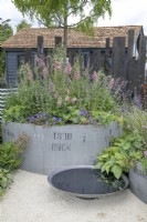 Circular reclaimed industrial planters in The Vitamin G Garden at RHS Hampton Court Palace Garden Festival 2022