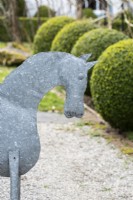 Tin horse in a spring garden