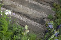 Railway sleepers with gravel in between in the Task Garden at RHS Malvern Spring Festival 2022