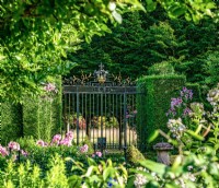 The reclaimed gates in the Sundial Garden was found and adapted for Highgrove, July, 2022.