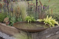 Corten steel bird bath in the Pretty Wild Beautiful Border at BBC Gardener's World Live 2022