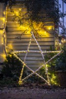 Illuminated hazel stick star with fairy lights
