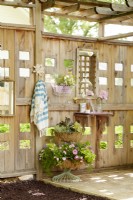 Pergola with trellis sides, used to hang mirrors and shelving 