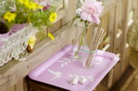 Vintage painted tray on trellis with foliage and butterfly stencils