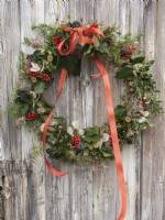 Completed Christmas wreath with fresh foliage,iris berries and dried seed heads