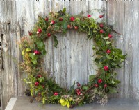Completed Christmas wreath with porcelain toadstools and garden foliage