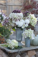 Autumn bouquet of hydrangea flowers and chrysanthemums in a zinc vase