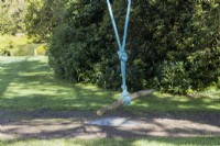 A rope swing using a piece of wood. Regency House, Devon NGS garden. Autumn