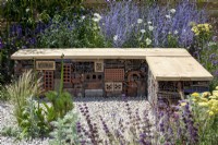 Insect hotel built into a wood and gabion bench - Turfed Out Garden, RHS Hampton Court Palace Garden Festival 2022
