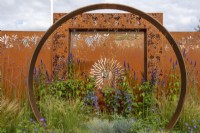 Corten steel moongate by Simon Probyn - Sunburst Garden, RHS Hampton Court Palace Garden Festival 2022
