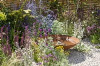 Gravel planting around a Corten steel water bowl - Turfed Out Garden, RHS Hampton Court Palace Garden Festival 2022