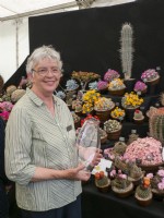 Linda Goodey with her award for best exhibit in the floral marquee at the 2022 RHS Malvern Spring Festival