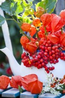 Floral arrangement with rowan berries and Chinese lantern.