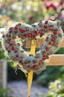 Wreath made of lichen, rose hips and acorns.