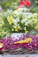 Yellow - white themed bouquet with Antirrhinum and wild carrots.