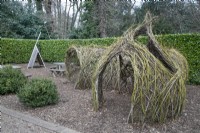 Woven willow tunnels in the play area at Winterbourne Botanic Garden - March