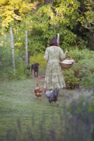 Susie Harris-LeBlond with her pet chickens and labrador