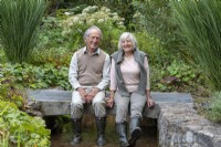 Neil and Pamela Millward in the  country garden they have lovingly created since 2002 in a tranquil Devon valley.