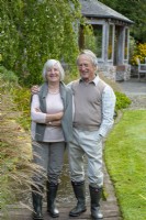 Neil and Pamela Millward in the  country garden they have lovingly created since 2002 in a tranquil Devon valley.