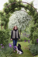 Woman in garden with her spaniel in May