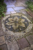 Pebble mosaic set into a terrace at Ellicar gardens.