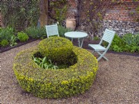 Circular box hedge and Topiary with seating area