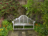 Secluded garden bench, and climbers  East Ruston Old Vicarage Gardens Norfolk May Spring