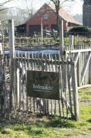Sign in dutch on fence of regenerative demonstration farm Bodemzicht / Soil perspective.