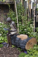 Bronze sculpture of a woman entitled 