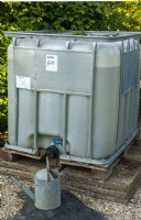 Water storage in the garden in recycled industrial tank