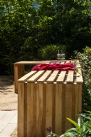 Wooden L-shaped slatted wood bench - The Beauty in Small Spaces - BBC Gardeners' World Live 2023 - Designers TJ Kennedy and Kerianne Fitzpatrick